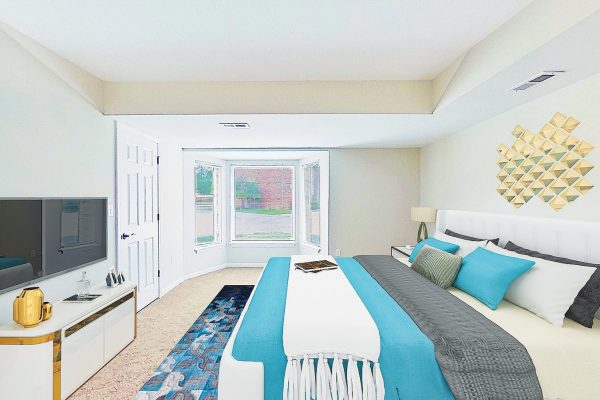 Modern bedroom with teal accents, large windows, geometric wall art, and a flat-screen TV. Bright and stylish decor.