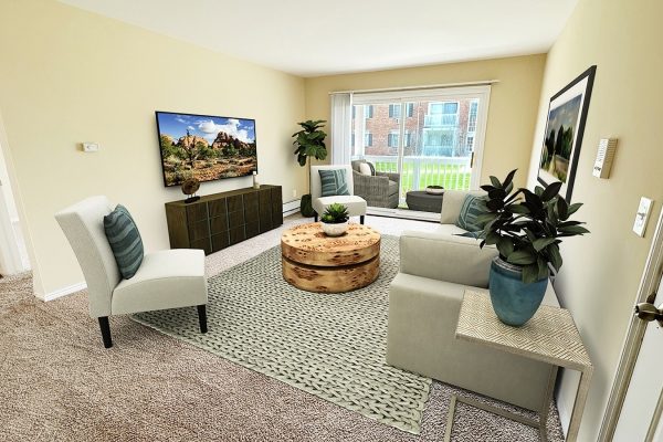 Modern living room with beige walls, cozy furniture, large TV, and plants, offering a bright, inviting atmosphere.