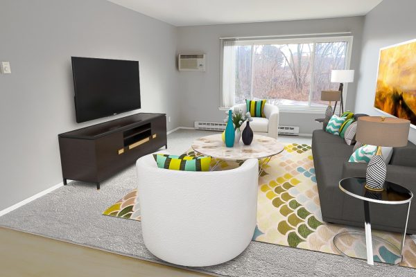 Modern living room with gray walls, stylish furniture, colorful pillows, large window, and abstract wall art.