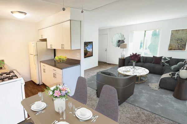 Modern open-plan kitchen and living room with dining area, stylish decor, and comfortable seating.