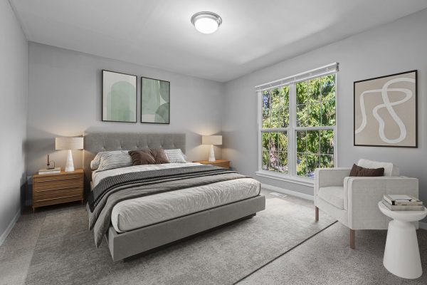 Modern gray bedroom with large windows, cozy bed, wooden nightstands, and abstract wall art for a serene ambiance.
